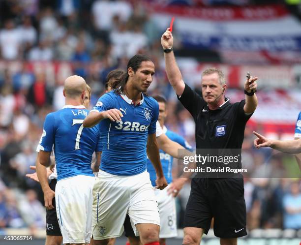 Bilel Mohsni of Rangers is sent off by referee Mark Heywood during the pre season friendly match between Derby County and Rangers at iPro Stadium on...