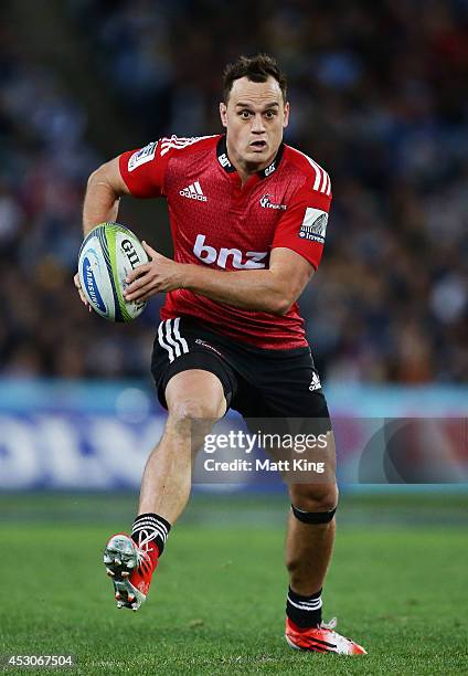 Israel Dagg of the Crusaders runs with the ball during the Super Rugby Grand Final match between the Waratahs and the Crusaders at ANZ Stadium on...