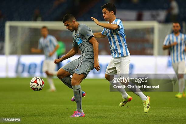 Juanpi of Malaga challenges Mehdi Abeid of Newcastle United during the match between FC Malaga and Newcastle United as part of the Schalke 04 Cup Day...