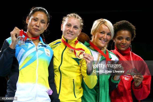 Gold medalist Shelley Watts of Australia poses with silver Laishram Devi of India and bronze medalists Alanna Audley-Murphy of Northern Ireland and...