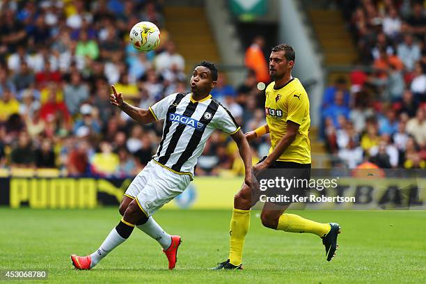 Luis Muriel of Udinese and Gabriel Tamas of Watford challenge for the ball during the pre-season friendly between Watford and Udinese at Vicarage...