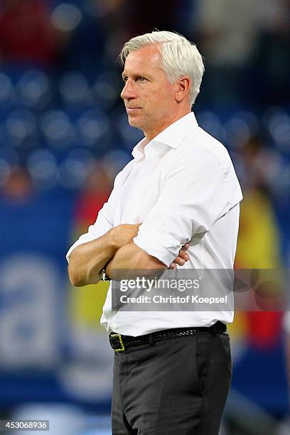 Head coach Alan Pardew of Newcastle United looks thoughtful during the match between FC Malaga and Newcastle United as part of the Schalke 04 Cup Day...