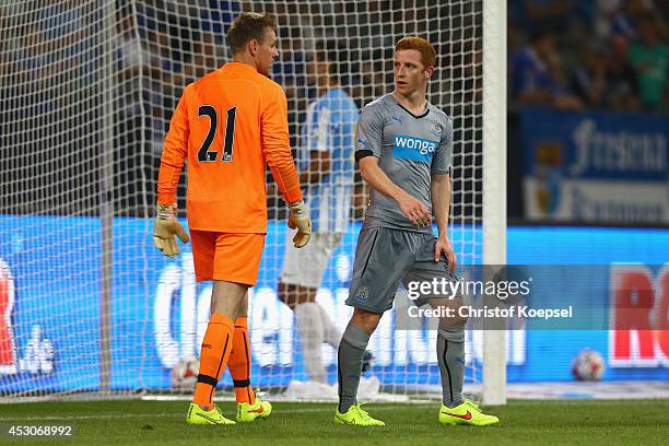 Rob Elliot of Newcastle United and Jack Colback of Newcastle United look at each other during the match between FC Malaga and Newcastle United as...