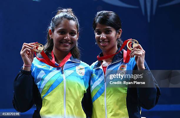 Dipika Pallikal and Joshana Chinappa of India celebrate with their Gold medals after the Squash Women's Doubles Final at Scotstoun Sports Campus...