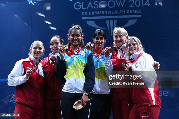 Laura Massaro and Jenny Duncalf of England, Dipika Pallikal and Joshana Chinappa of India and Alison Waters and Emma Beddoes of England celebrate...