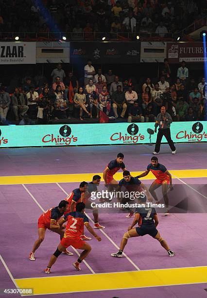 Players of Bengal Warriors in action against Puneri Paltan players in first edition of Pro Kabaddi tournament at Netaji Indoor Stadium, on August 1,...