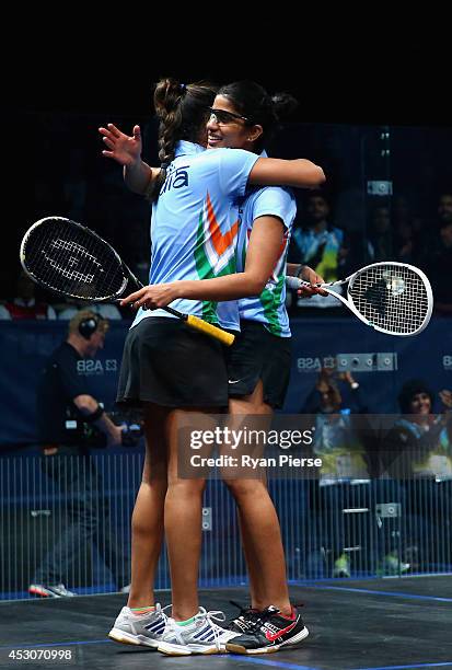 Dipika Pallikal and Joshana Chinappa of India celebrate victory over Laura Massaro and Jenny Duncalf of England during the Squash Women's Doubles...