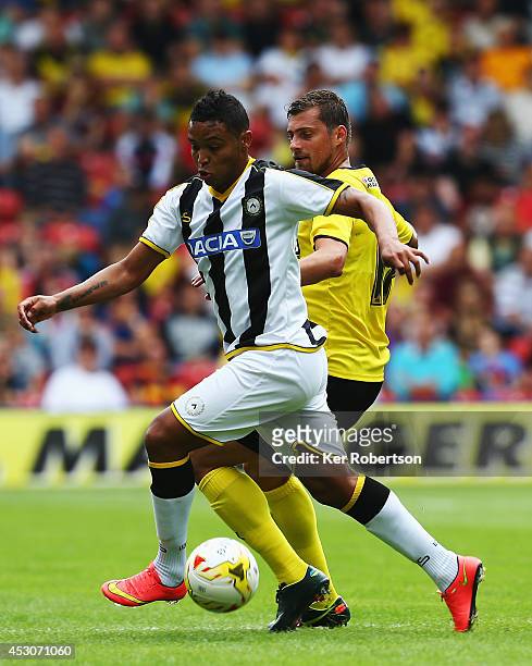 Luis Muriel of Udinese and Gabriel Tamas of Watford challenge for the ball during the pre-season friendly between Watford and Udinese at Vicarage...
