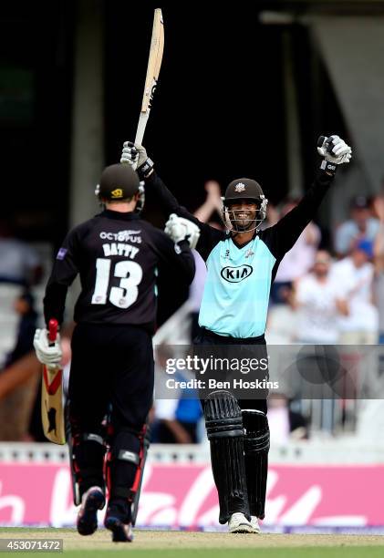 Robin Peterson of Surrey celebrates with team mate Gareth Batty after scoring the winning runs during the Natwest T20 Blast Quarter Final match...