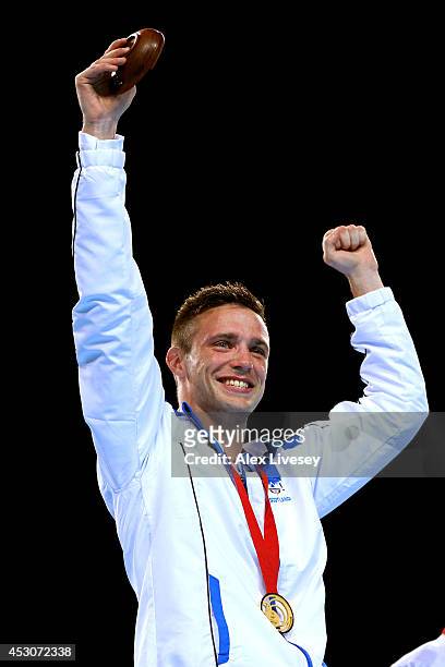 Gold medalist Josh Taylor of Scotland celebrates during the medal ceremony for the Men's Light Welter Final at SSE Hydro during day ten of the...