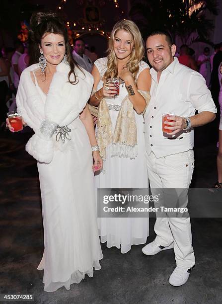 Lisa Vanderpump and Pandora Vanderpump-Sabo pose with a guest during the debut of LVP sangria at The White Party in Miami and help raise awareness...