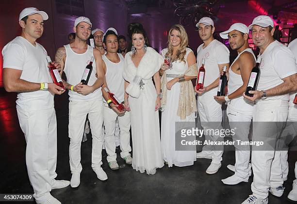 Lisa Vanderpump and Pandora Vanderpump-Sabo pose with guests during the debut of LVP sangria at The White Party in Miami and help raise awareness for...