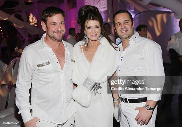 Lisa Vanderpump poses with guests while debuting LVP sangria at The White Party in Miami and help raise awareness for HIV/AIDS at Soho Studios on...