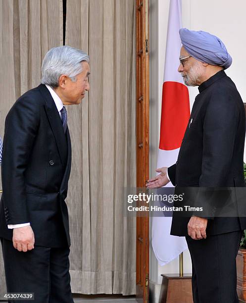 Indian Prime Minister Manmohan Singh with Japanese Emperor Akihito ahead of a meeting at Hyderabad House on December 2, 2013 in New Delhi, India....