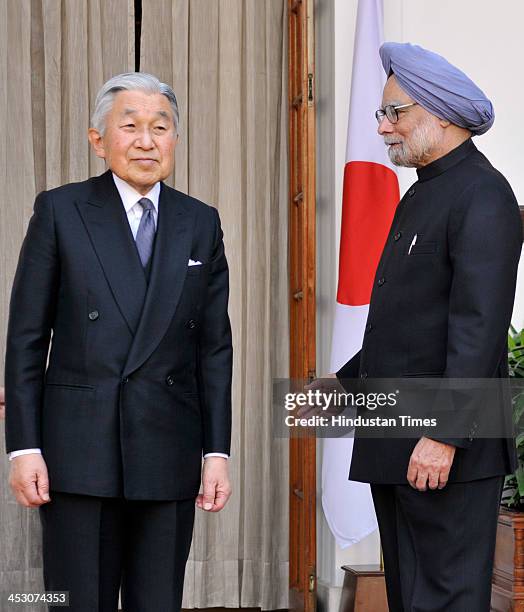 Indian Prime Minister Manmohan Singh with Japanese Emperor Akihito ahead of a meeting at Hyderabad House on December 2, 2013 in New Delhi, India....