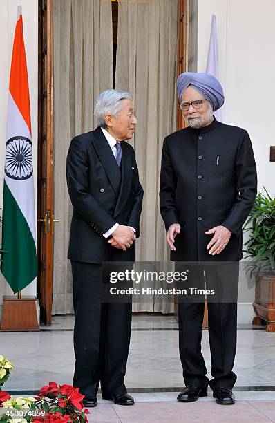 Indian Prime Minister Manmohan Singh with Japanese Emperor Akihito ahead of a meeting at Hyderabad House on December 2, 2013 in New Delhi, India....