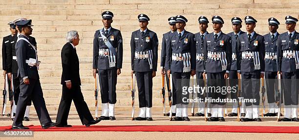Japanese Emperor Akihito inspecting the guard of honour during his ceremonial reception at Rashtrapati Bhawan on December 2, 2013 in New Delhi,...