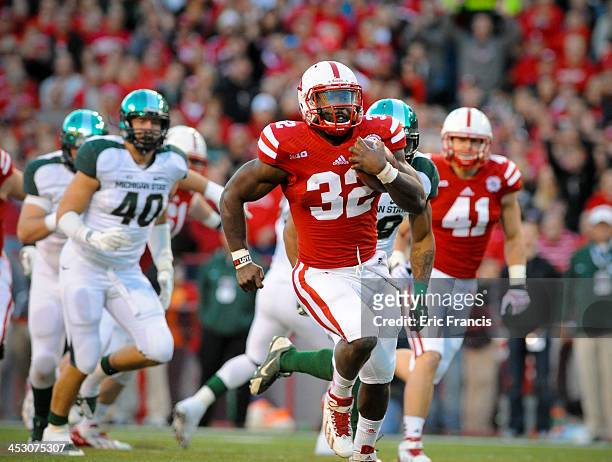 Running back Imani Cross of the Nebraska Cornhuskers runs for a touchdown during their game against the Michigan State Spartans at Memorial Stadium...