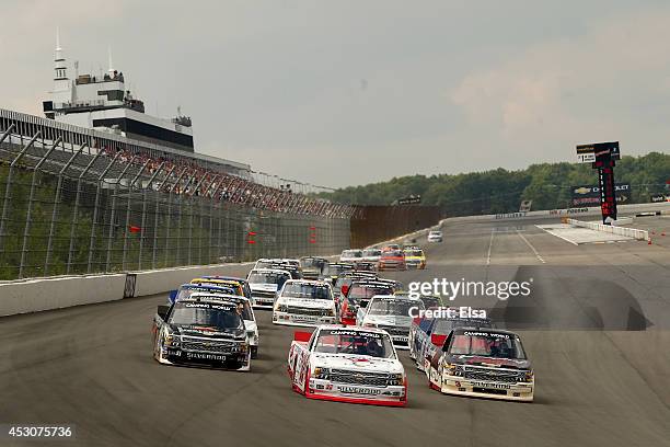 Kyle Larson, driver of the Cartwheel by Target Chevrolet, leads the field to start the NASCAR Camping World Truck Series Pocono Mountains 150 at...