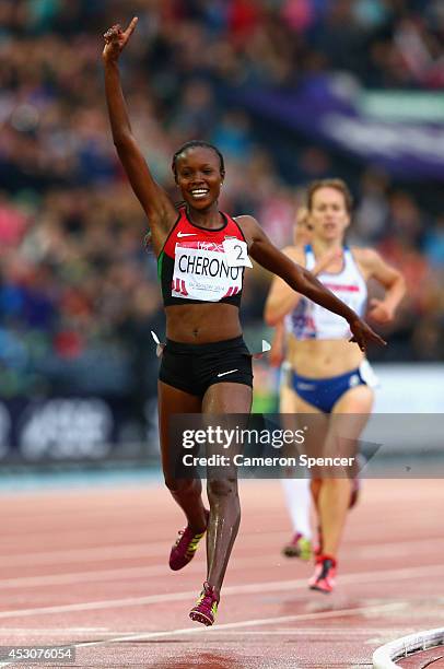 Mercy Cherono of Kenya crosses the line to win gold in the Women's 5000 metres final at Hampden Park during day ten of the Glasgow 2014 Commonwealth...