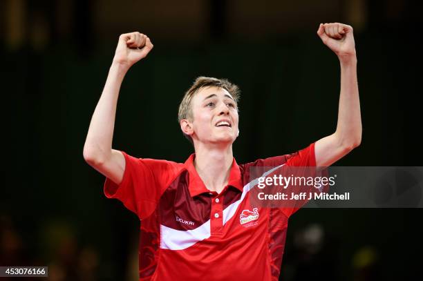 Liam Pitchford of England celebrates winning against Sharath Kamal Achanta of India in the Men's Singles Bronze Medal Match at Scotstoun Sports...