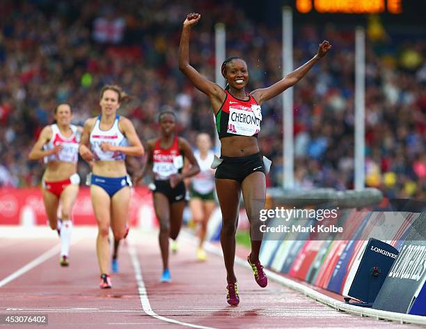 Mercy Cherono of Kenya crosses the line to win gold in the Women's 5000 metres final at Hampden Park during day ten of the Glasgow 2014 Commonwealth...
