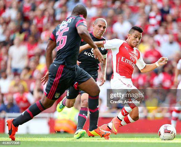 Alexis Sanchez of Arsenal in action against his opponents during the Emirates Cup 2014 soccer match between Arsenal and Benfica at the Emirates...