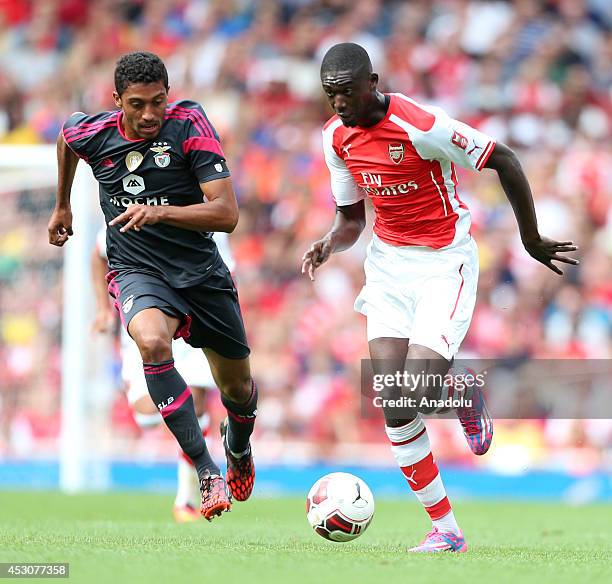 Yaya Sanogo of Arsenal in action against his opponent during the Emirates Cup 2014 soccer match between Arsenal and Benfica at the Emirates Stadium...