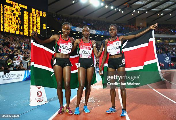 Gold medalist Mercy Cherono of Kenya, silver medalist Janet Kisa of Kenya and Margaret Muriuki of Kenya pose after the Women's 5000 metres final at...