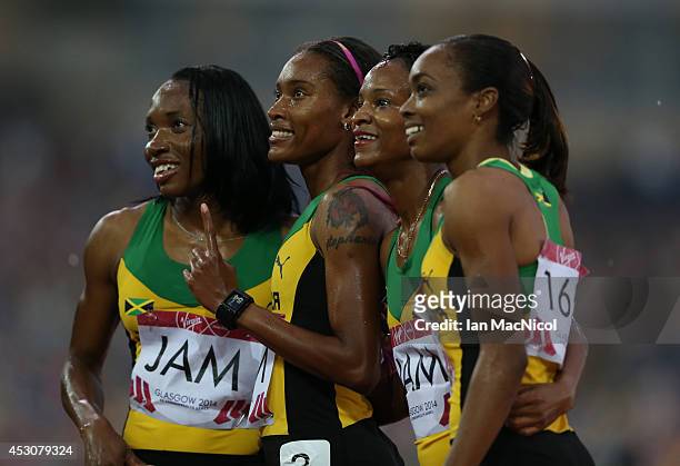 Christine Day, Novlene Williams-Mills of Jamaica, Anastasia le-Roy and Stephanie McPherson of Jamaica celebrate winning the Women's 4x400m Relay at...