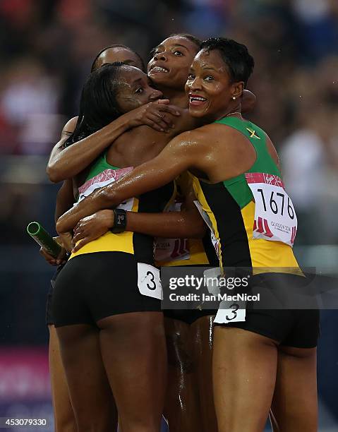 Christine Day, Novlene Williams-Mills of Jamaica, Anastasia le-Roy and Stephanie McPherson of Jamaica celebrate winning the Women's 4x400m Relay at...