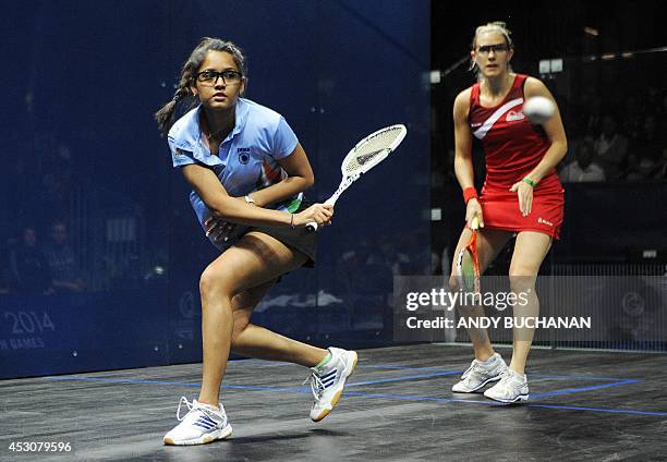Dipika Pallikal of India and Laura Massaro of England compete in the women's gold medal match in the Women's Doubles Squash competition at Scotstoun...