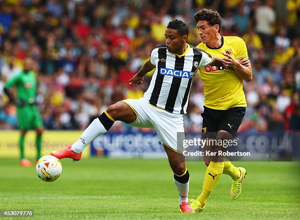 Luis Muriel of Udinese and Keith Andrews of Watford challenge for the ball during the pre-season friendly between Watford and Udinese at Vicarage...