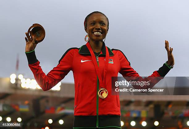 Gold medalist Mercy Cherono of Kenya poses on the podium during the medal ceremony for the Womens 5000 metres at Hampden Park during day ten of the...