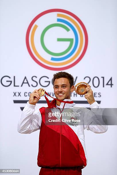 Tom Daley of England celebrates on the podium after winning the Gold medal in the Men's 10m Platform Final at the Royal Commonwealth Pool during day...