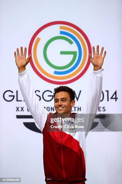 Tom Daley of England celebrates on the podium after winning the Gold medal in the Men's 10m Platform Final at the Royal Commonwealth Pool during day...