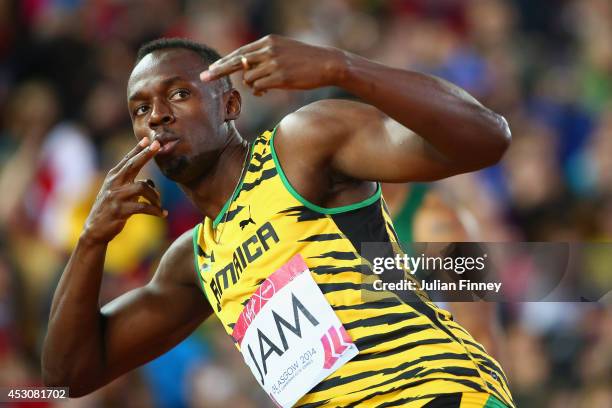 Usain Bolt of Jamaica celebrates winning gold in the Mens 4x100 metres relay final at Hampden Park during day ten of the Glasgow 2014 Commonwealth...