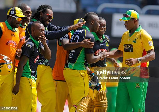 Christopher Barnwell of Guyana Amazon Warriors greets Andre Russell of Jamaica Tallawahs after a match between Jamaica Tallawahs and Guyana Amazon...