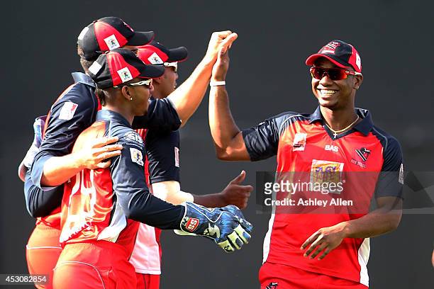 Evin Lewis celebrates with his team mates during a match between St. Lucia Zouks and The Trinidad and Tobago Red Steel as part of week 4 of the...