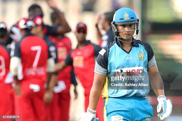 Henry Davids of St. Lucia Zouks walks off the field after being dismissed during a match between St. Lucia Zouks and The Trinidad and Tobago Red...