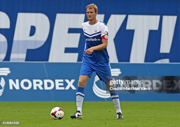 Christian Stuff of Rostock runs with the ball during the third league match between FC Hansa Rostock and Rot Weiss Erfurt at DKB-Arena on August 2,...