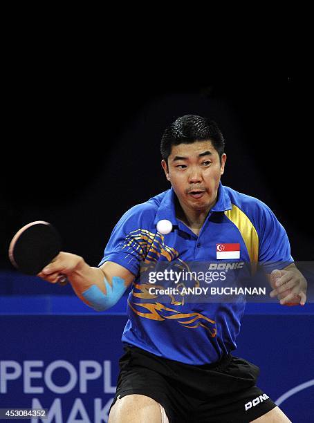 Zhan Jian of Singapore on his way to victory over Gao Ning of Singapore in the gold medal match in the men's singles Table Tennis competition at...