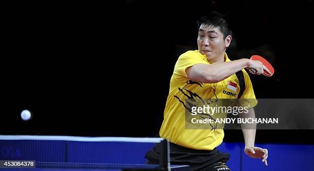 Gao Ning of Singapore in action against Zhan Jian of Singapore in the gold medal match in the men's singles Table Tennis competition at Scotstoun...
