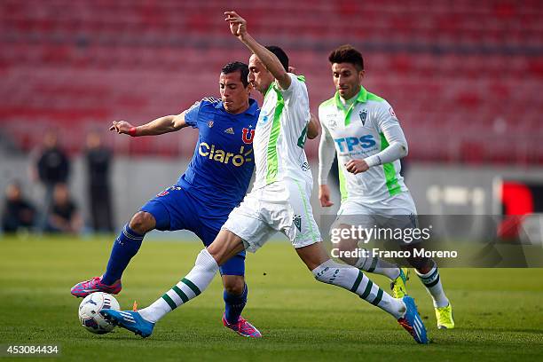 Sebastian Ubilla of U de Chile fights for the ball with Mauricio Prieto of Wanderers during a match between U de Chile and Wanderers as part of third...