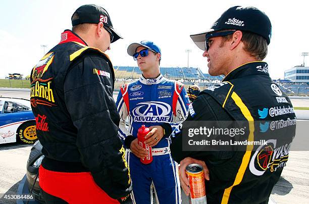 Michael McDowell, driver of the Pizza Ranch Toyota, Trevor Bayne, driver of the AdvoCare Ford, and Blake Koch, driver of the Supportmillitary.org...