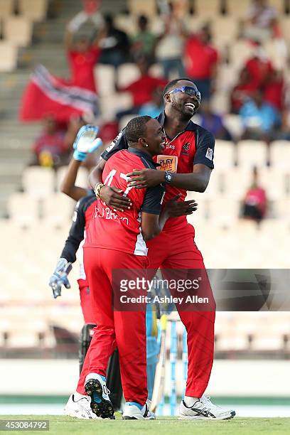 Sulieman Benn and Dwayne Bravo of The Red Steel laugh during a match between St. Lucia Zouks and The Trinidad and Tobago Red Steel as part of week 4...