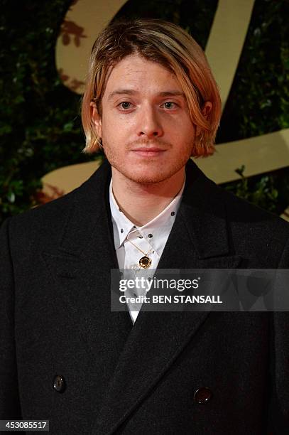 British jewellery designer Dominic Jones poses on the red carpet as she arrives for the British Fashion Awards in London on December 2, 2013. AFP...