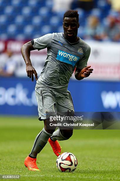Massadio Haidara of Newcastle United runs with the ball during the match between FC Malaga and Newcastle United as part of the Schalke 04 Cup Day at...
