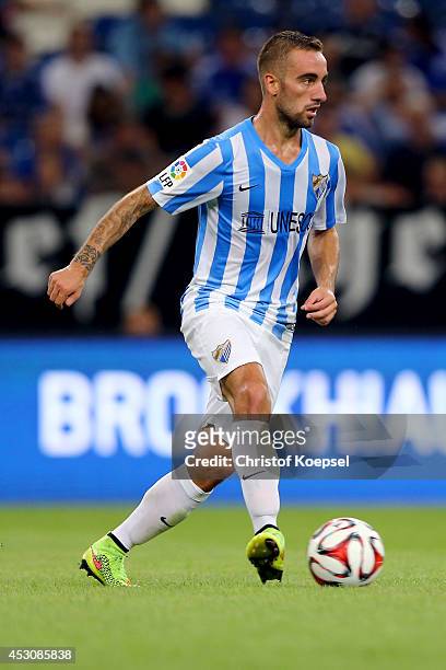 Viktorino Antunes of Malaga runs with the ball during the match between FC Malaga and Newcastle United as part of the Schalke 04 Cup Day at...