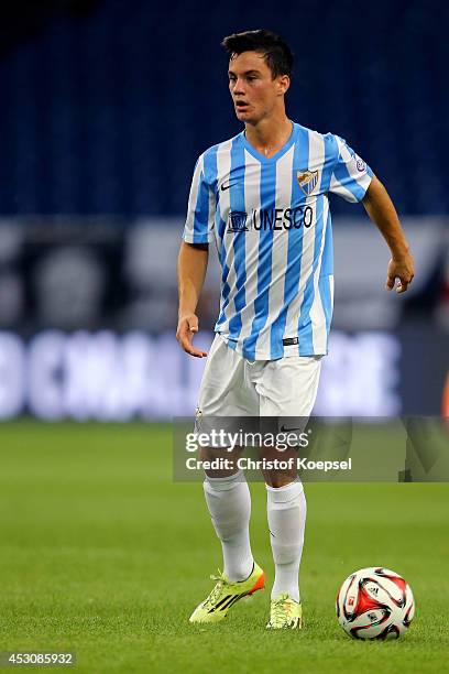 Juanpi of Malagamruns with the ball during the match between FC Malaga and Newcastle United as part of the Schalke 04 Cup Day at Veltins-Arena on...